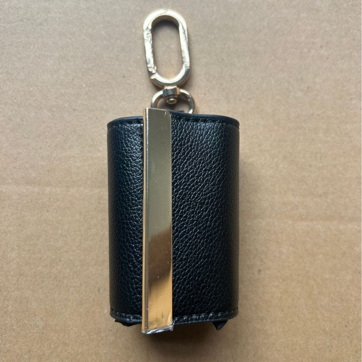 In a backpack: Flat against the back panel.